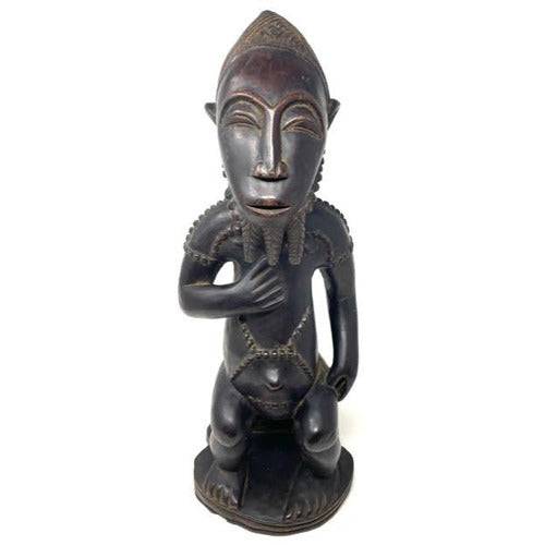 Carved African Statue of Tribal Man - Anecdote